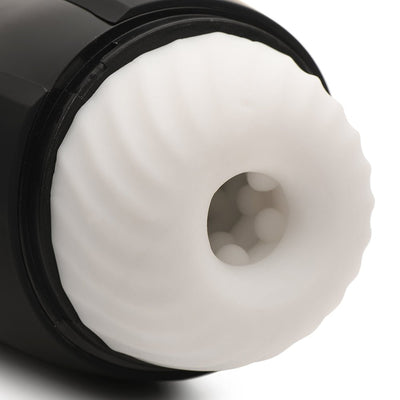 Close-up of the soft, textured white sleeve inside the black casing of the Lovebotz The Milker Max masturbator.