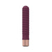 Slim ribbed mini vibrator in deep plum with rose gold base, made from smooth silicone.