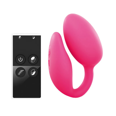 Pink dual stimulator with curved design and black wireless remote control with four buttons on white background.