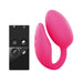 Pink dual stimulator with curved design and black wireless remote control with four buttons on white background.