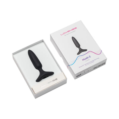 Lovense Hush 2 black silicone butt plug displayed in white packaging with product box beside it on white background.