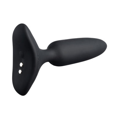 Black silicone Lovense Hush 2 app-compatible butt plug with magnetic charging port and flared base.