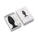 Lovense Hush 2 black silicone butt plug with flared base in white box packaging with charging cable.