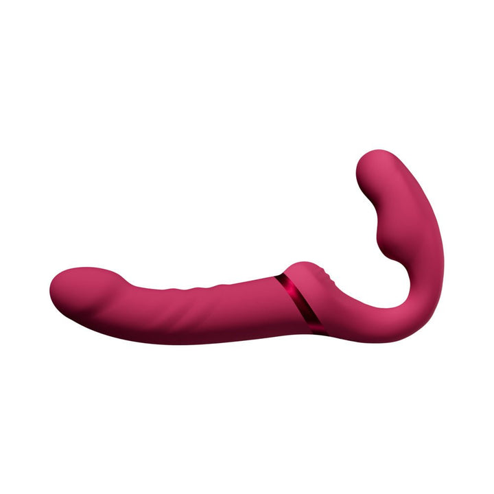 Flexible double-ended strapless strap-on in deep pink silicone with textured shaft and curved bulb for dual stimulation.