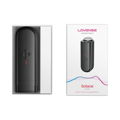 Lovense Solace automatic thrusting male masturbator in black with control buttons shown inside open white packaging and box.