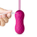 Hand plugging USB charger into textured pink Lush Carina insertable bullet vibrator with pull loop.