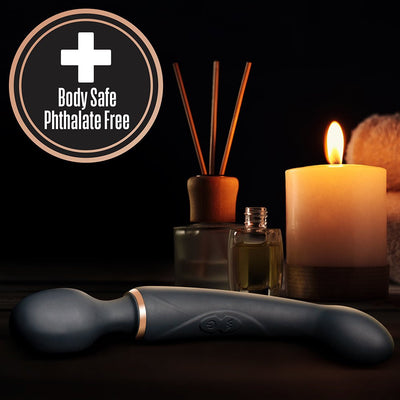 Lush Gia Black dual-ended massager with smooth silicone finish displayed with candle and diffuser, body safe phthalate free label.