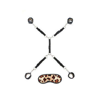 Black adjustable bed restraint system with leopard print soft cuffs and matching leopard print blindfold.