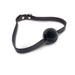 Black adjustable ball gag with textured strap and metal buckle on white background