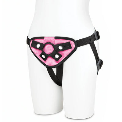 Black and pink neoprene strap on harness with adjustable straps displayed on a white mannequin.