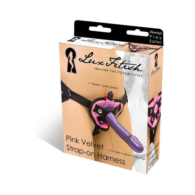 Lux Fetish Pink Velvet Strap-On Harness packaging showing adjustable black straps and bullet vibe pocket.