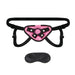 Black and pink neoprene strap-on harness with adjustable straps and included black blindfold.