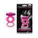 Magenta Magna Man magnetic pleasure ring with textured design and dual loops next to its black packaging featuring a couple.