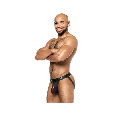 Male model wearing Male Power Hocus Pocus Uplift Jock in purple with black waistband and straps, smiling with arms crossed.
