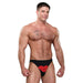Muscular man wearing black bikini underwear with a bold red lips design on the front against a white background.
