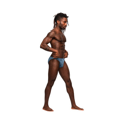 Athletic man wearing blue low-cut Male Power Inter-mingle Moonshine jock brief standing in profile on white background.