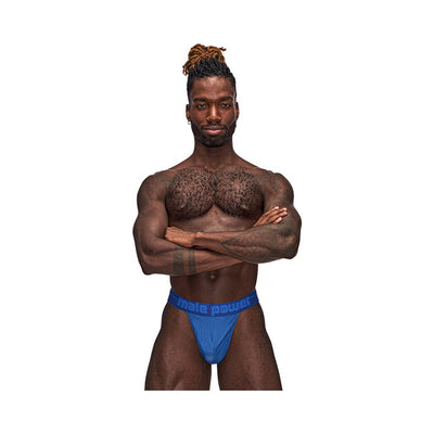 Male model wearing blue Male Power Sexagon Micro V Thong with branded waistband and hexagon print fabric.