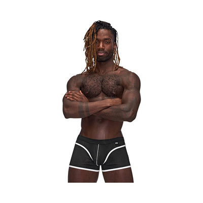 Athletic man wearing black Male Power Sport Mesh mini shorts with white trim and logo on waistband against white background.