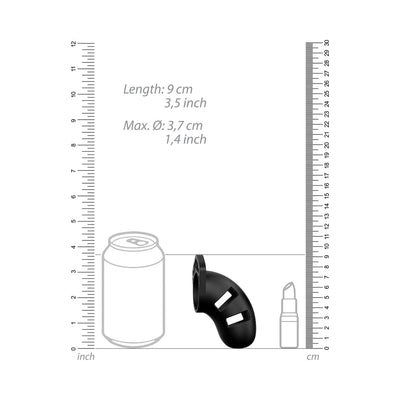 Black silicone cock cage with ventilation slots shown next to size comparison graphics and measurement scales.