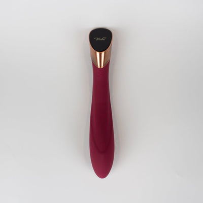 Sleek wine red Manto Touch Panel G-spot vibrator with curved silicone body and rose gold accent on a white background.