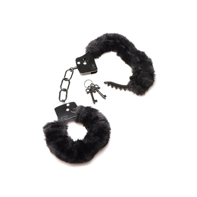 Black furry handcuffs with soft faux fur lining, metal chain, and two small keys on a white background.