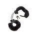 Black furry handcuffs with soft faux fur lining, metal chain, and two small keys on a white background.