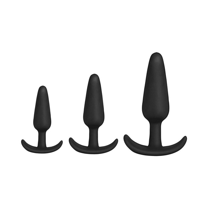 Three black silicone anal trainers in small, medium, and large sizes with curved bases for comfort and safety.