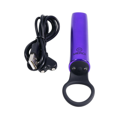 Compact violet Merci Power Play vibrator with black silicone grip ring and USB magnetic charging cable.