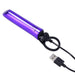 Compact violet Merci Power Play vibrator with black silicone grip ring and USB charging cable on white background.
