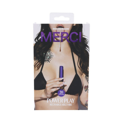 Packaging of Merci Power Play rechargeable violet vibrator with silicone grip ring held by a tattooed woman in a black bikini top.