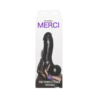 Packaging of Merci The Perfect Cock 10.5-inch black realistic dildo with Vac-U-Lock suction cup shown held by a hand.