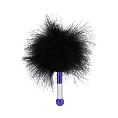 Black feather tickler with a clear and purple handle for sensory play in the Merci The Vip Room BDSM set.