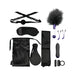 Black satin BDSM set with blindfold, ball gag, feather tickler, nipple clamps, vibrator, paddle, straps, and storage bag.