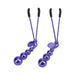 Pair of purple metal nipple clamps with black silicone tips and adjustable tension rods.