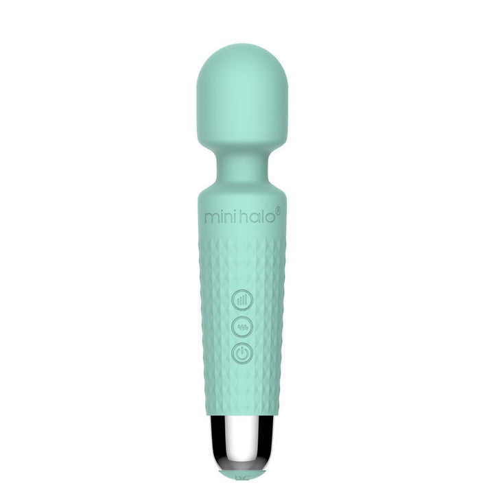 Compact mint green Mini Halo wireless wand with textured grip and three control buttons, sleek silver base.