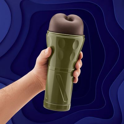 Hand holding olive green Model B-02 Stroker with soft, textured sleeve against a blue abstract background.
