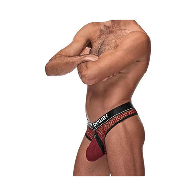 Male model wearing red fishnet cock ring thong with black elastic waistband and snap-off pouch detail, side view.