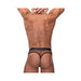 Rear view of a man wearing a red fishnet thong with black trim and a satin-finished waistband.