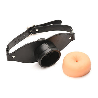Black adjustable vegan leather strap gag with removable flesh-toned soft TPE insert shaped like a realistic orifice.