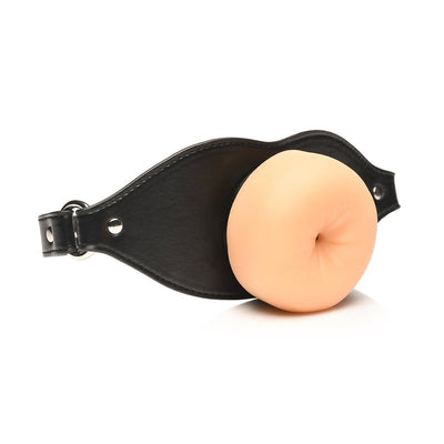 Black vegan leather strap gag with a realistic, soft TPE flesh-colored detail in the center.