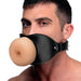 Man wearing a black vegan leather strap gag with a realistic, flesh-toned TPE textured front piece.