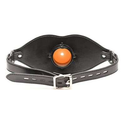 Black adjustable vegan leather mouth gag with central round orange insert and metal buckle closure.
