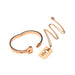 Rose-gold locking bracelet with heart-shaped clasp and matching key necklace on a chain, elegant tungsten steel jewelry set.