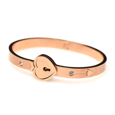 Rose-gold plated locking bracelet with heart-shaped clasp and small crystal accents on a white background.