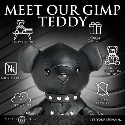 Black vegan leather teddy bear in a detailed gimp outfit with silver studs, promoting edgy decor and a playful gift idea.
