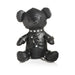 Black vegan leather teddy bear dressed in detailed gimp harness and collar with silver studs and rings.