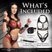 Woman wearing Master Series black vegan leather adjustable harness over red lace lingerie, shown with included wrist cuffs and cuff connectors.