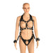 Black vegan leather adjustable harness with gold metal accents and attached wrist restraints on a mannequin.