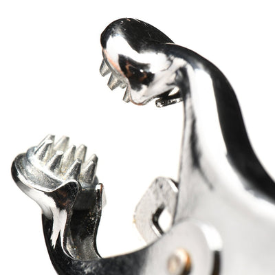 Close-up of silver spiked clover nipple clamp with sharp metal tips and polished finish on white background.