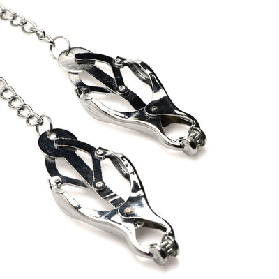 Silver metal spiked clover nipple clamps connected by a chain on a white background.